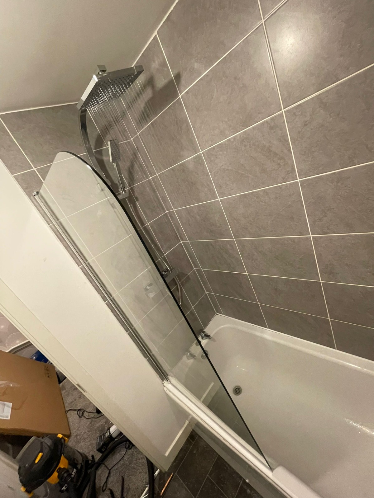 New bathtub and chrome rainfall shower installation