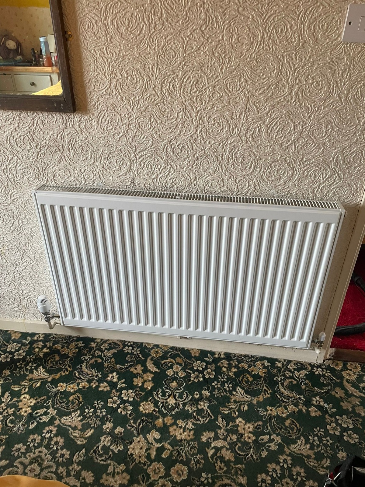 White panel radiator installed in living room