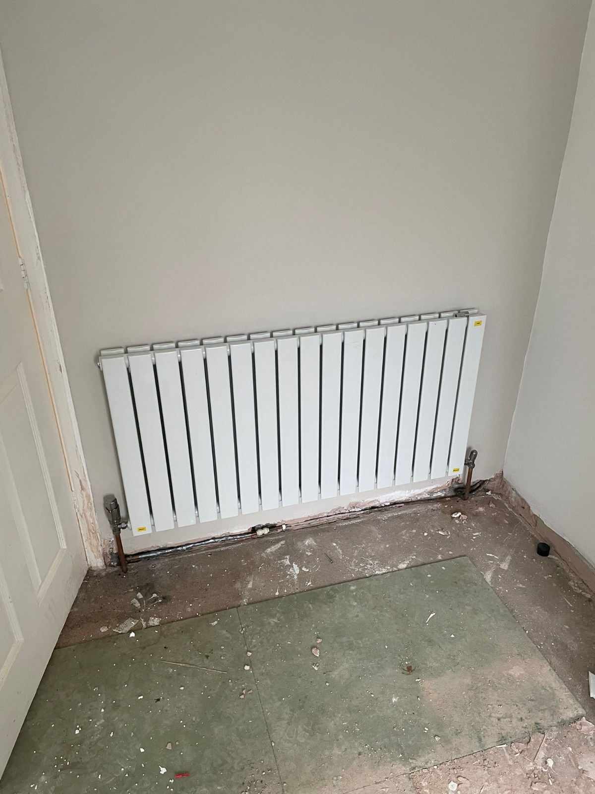 New vertical flat-panel central heating radiator installed in a Coventry home