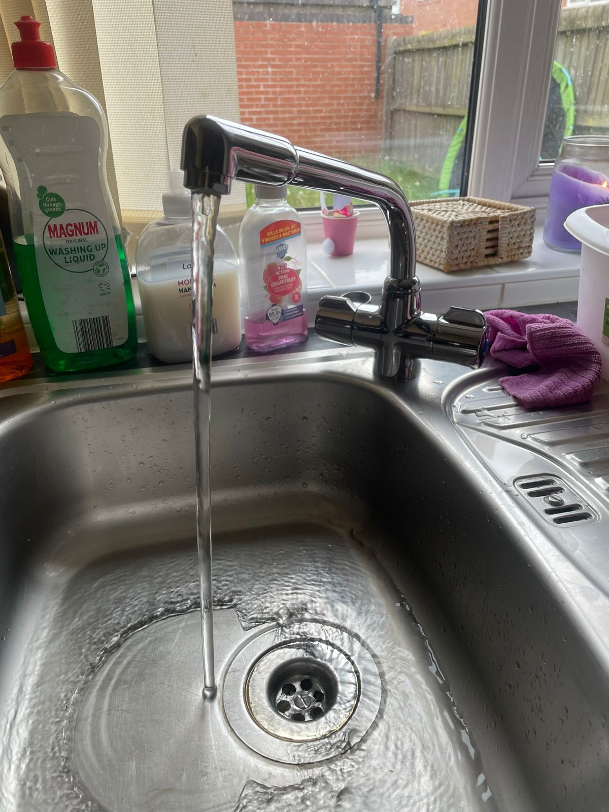 Chrome kitchen mixer tap running clear water after install