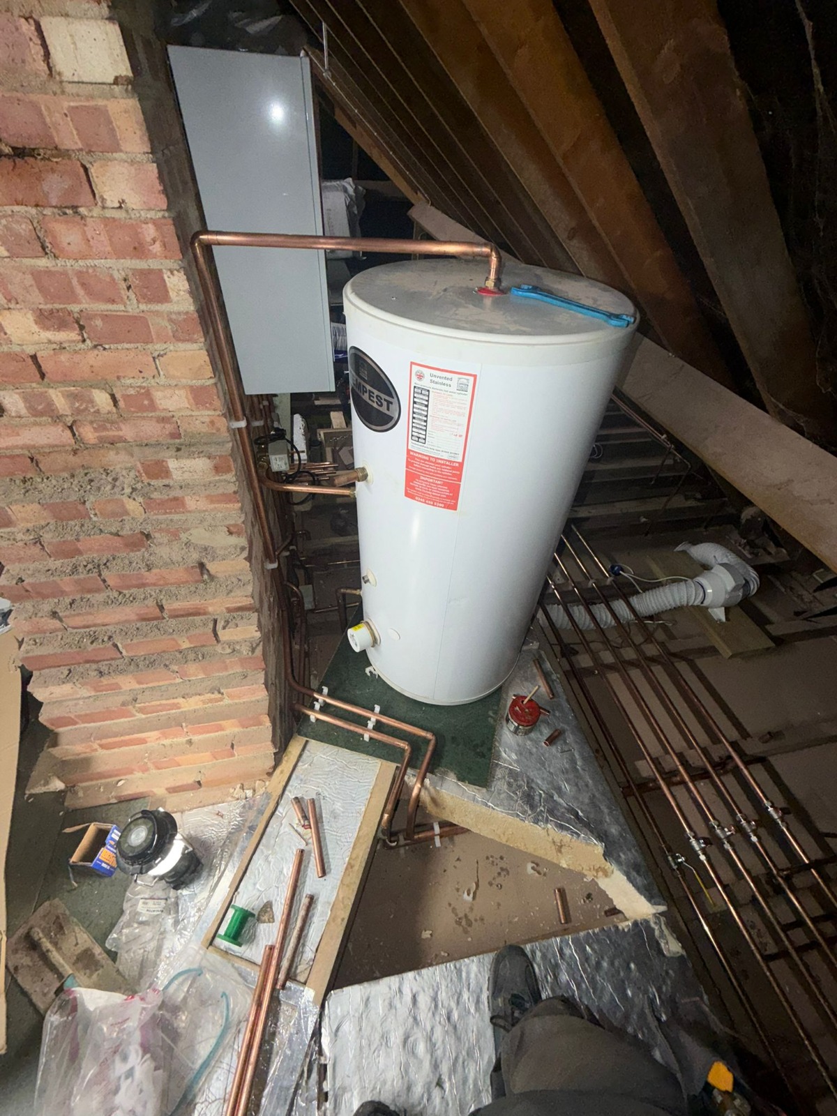 Unvented hot water cylinder installation in loft with copper pipework