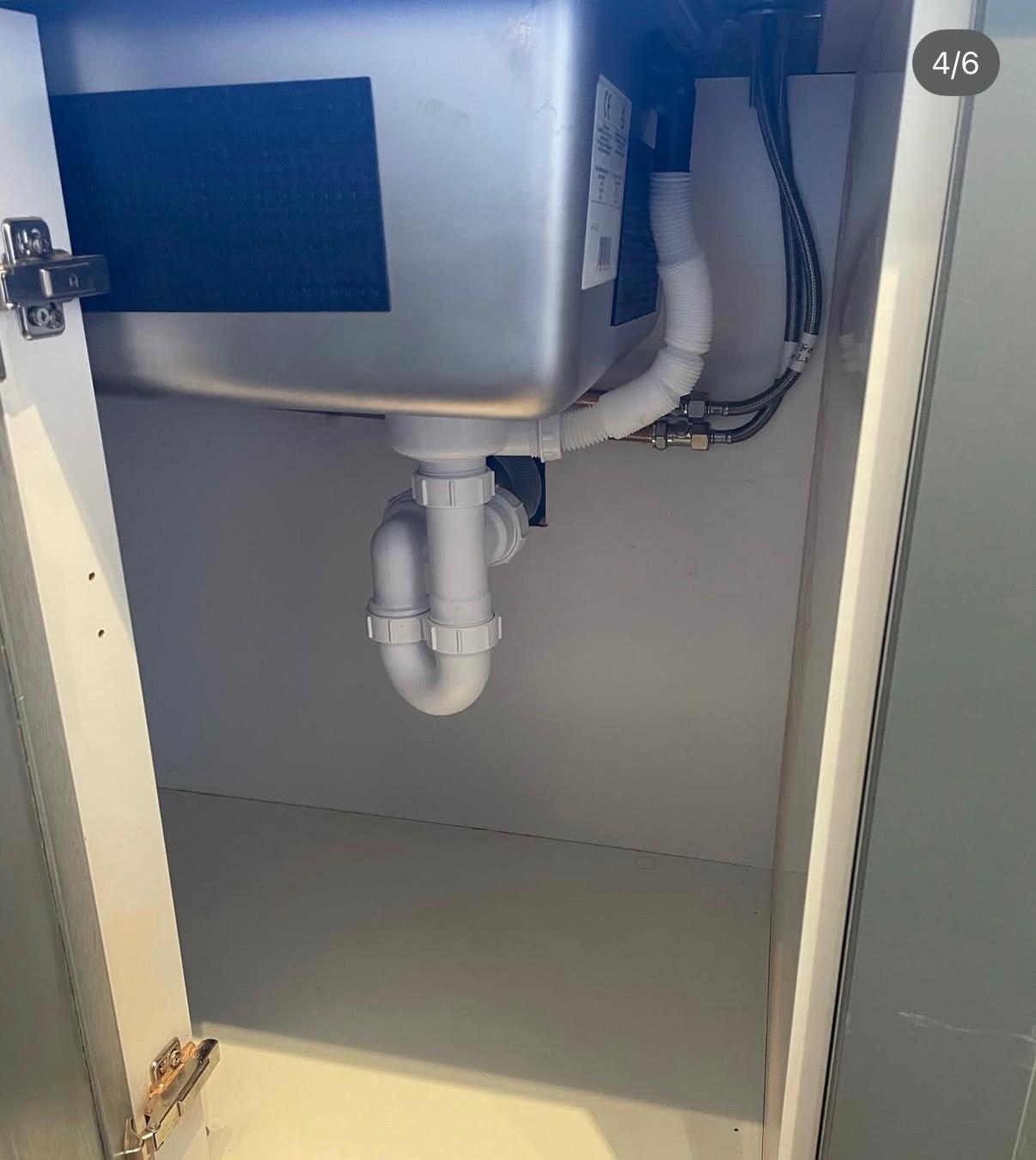 Under-sink pipework and washing machine waste connection